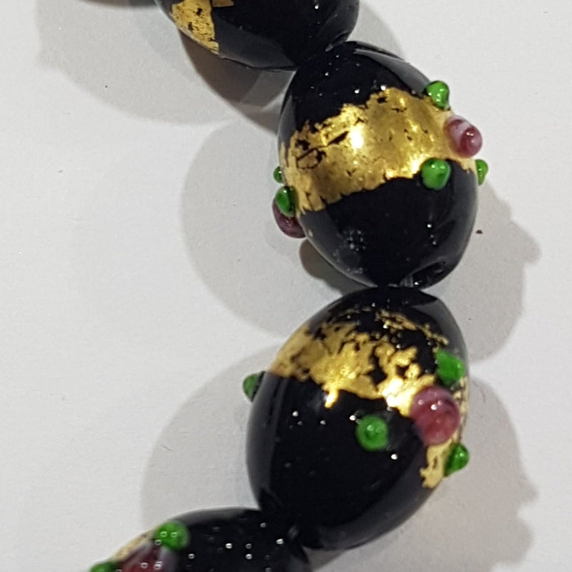 15mm Black Oval Lampwork bead with Florals & Gold Paint